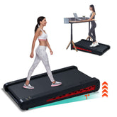 Strengthsphere Incline Walking Pad Treadmill used by a woman walking while working at a desk, featuring a 7-degree incline.